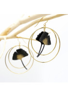 Ginko leaf earring framed by two gold-plated hoop earrings