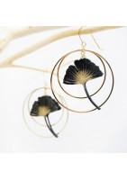 Ginko leaf earring framed by two gold-plated hoop earrings