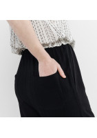 Black supple linen trousers, with 4 applied pockets, elasticated waist.