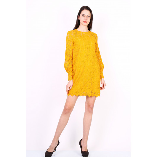 Short dress in yellow ochre lace with leaf pattern