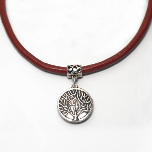 Red leather necklace and reversible silver chiselled Tree of Time pendant with Art Deco ironwork