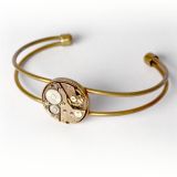 Bracelet bronze avec véritable ancien mouvement de montre suisse avec rubis