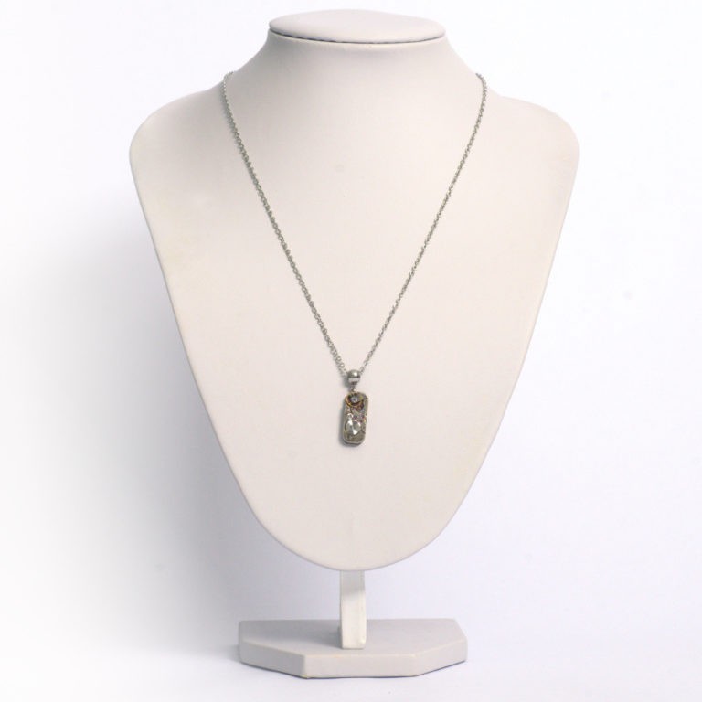 Necklace with an antique watch movement from the Swiss brand Baume & Mercier®