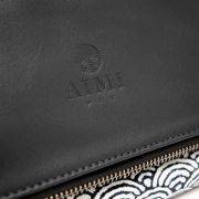 Sac pochette en cuir fin et tissu d'inspiration japonaise