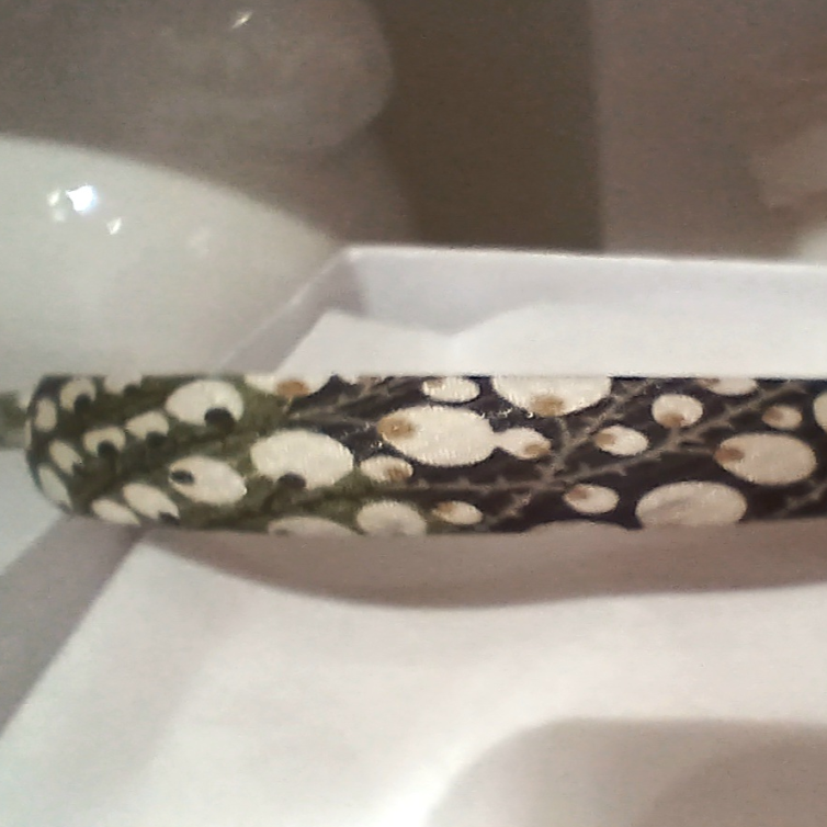 Tiara trimmed with kittens print silk fabric on spring branches black background