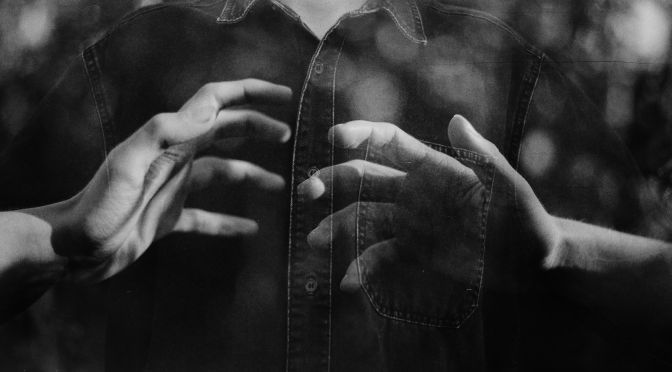 grayscale photo of person wearing button up shirt