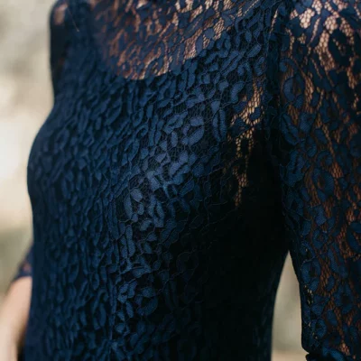 Long evening dress in navy lace and low back neckline