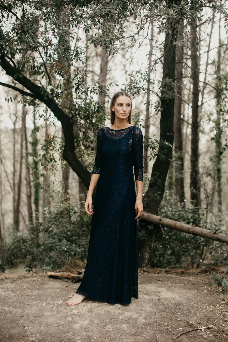 Long evening dress in navy lace and low back neckline